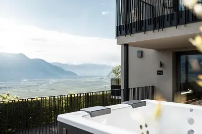 a bath tub sitting on the side of a building at My Spring - Panoramic Suites in Lana