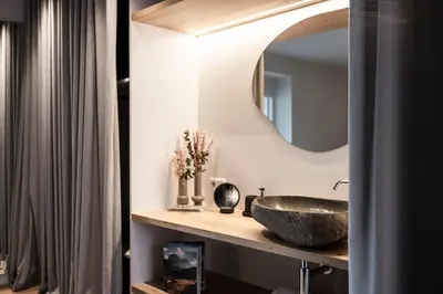 a bathroom with a sink and a mirror at My Spring - Panoramic Suites in Lana