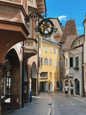 an empty street in a city with buildings at Rosa's Boutique Apartment in Merano