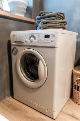 a washing machine with towels on top of it at La ciasota in Antermoia