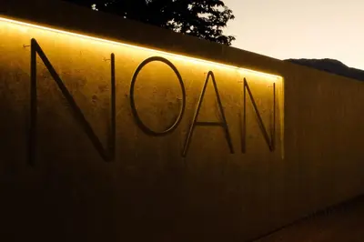 a sign that says noah on a wall at Noan Panorama Suiten - Arendt in San Genesio Atesino