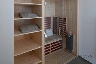 a room with wooden shelves in a room at Noan Panorama Suiten - Arendt in San Genesio Atesino