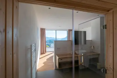 a bathroom with a sink and a mirror at Noan Panorama Suiten - Arendt in San Genesio Atesino