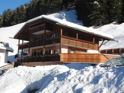a house in the snow with snow around it at Apartments Diamant in Ortisei