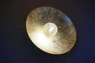 a close up of a circle with a light on it at La Ücia by Fana Ladina in San Vigilio Di Marebbe