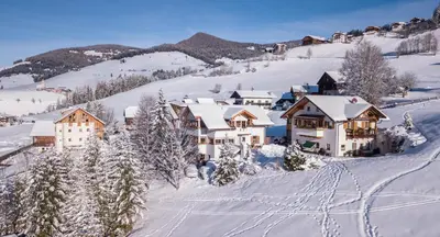 a resort in the mountains covered in snow at Apartments Ciastel in San Vigilio Di Marebbe