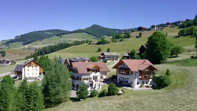 an aerial view of a house on a hill at Apartments Ciastel in San Vigilio Di Marebbe