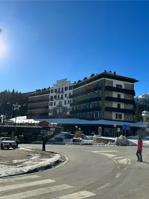a large building in the middle of a street at Panoramic apartment 71 in San Martino di Castrozza