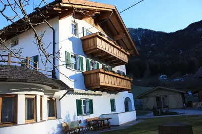 a building with balconies on the side of it at Villa Anna in Siusi