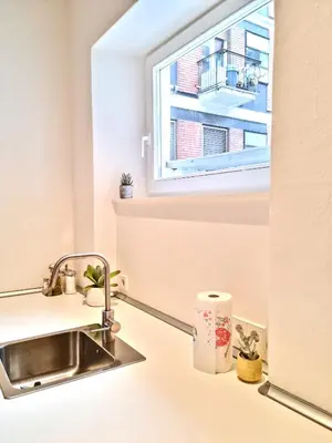 a kitchen with a sink and a window at Apartment Emilie with parking historic city center in Merano