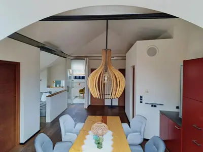a bedroom with a bed and a skylight at Mansarde Zeder in Privatvilla im Zentrum Merans in Merano