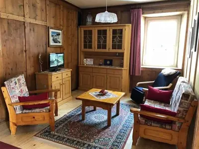 a living room with a couch and a table at Casa Sartori in Tesero