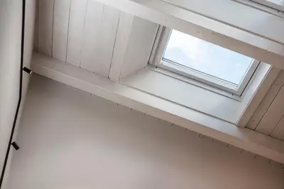 a window in a room with a white wall at Brixen City Maisonette in Bressanone