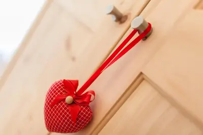 a red toothbrush is hanging on a door at Garni Appartment Wagnerhof in Rablà