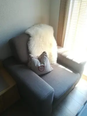 a stuffed animal sitting on a chair in a room at Garni Hattlerhof B&B in Brunico