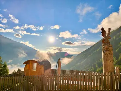 a wooden fence with a view of a mountain at Kröllhof in Vallarga