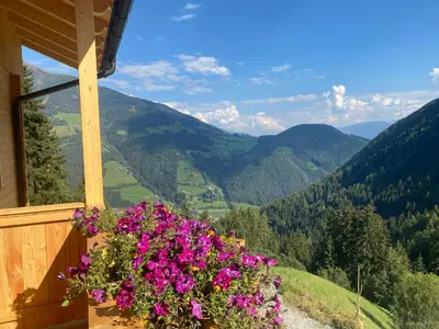 a balcony of a house with flowers on it at Kröllhof in Vallarga