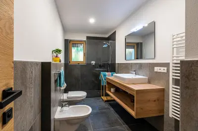 a bathroom with a sink and a toilet at Kröllhof in Vallarga