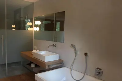 a bathroom with a sink and a mirror at Steindl's Boutique Hotel in Vipiteno
