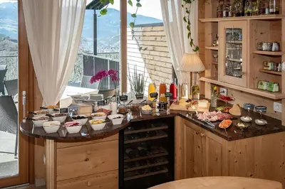 a kitchen with a bunch of food on a counter at Tirolerhof - panoramic apartments in Naz-Sciaves