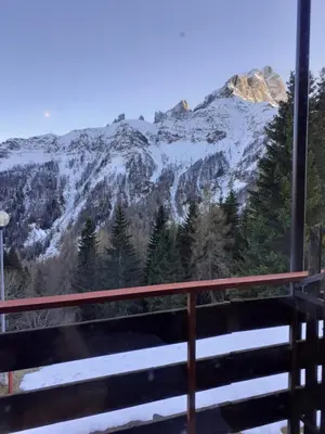 a view from the balcony of a mountain at Casa Neve e Sole - presso Sussy Residence in Falcade