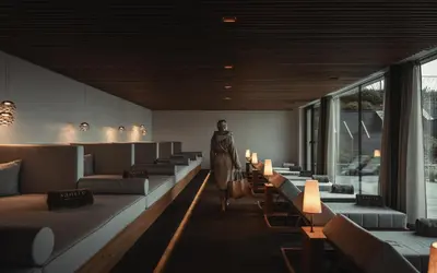 a room with couches and a statue in the middle at Santre dolomythic home in Bressanone