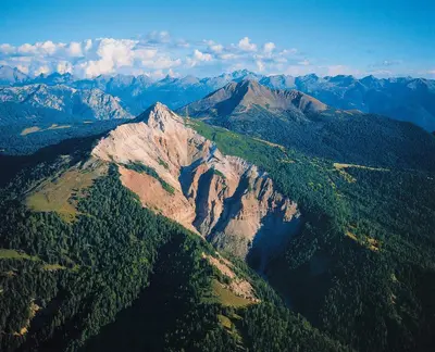 an aerial view of a mountain with trees and mountains at Berghütte Blockhaus in Redagno