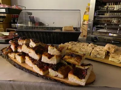 a pile of sandwiches on a cutting board on a counter at Hotel Pizboè in Mazzin