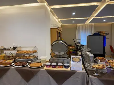 a table with many different types of food on it at Hotel Pizboè in Mazzin