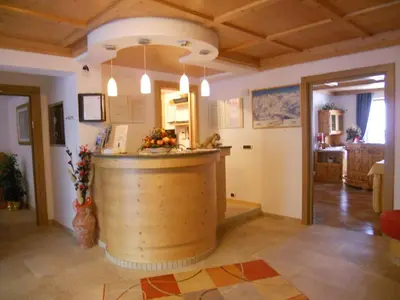 a bar in a room with a wine barrel at Residence Garni Manuela in Cavalese