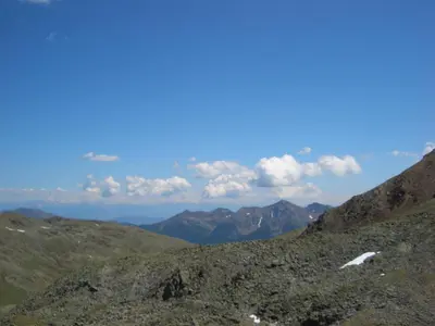 a view of the mountains from the top of a mountain at Alpina Residence in Naturno