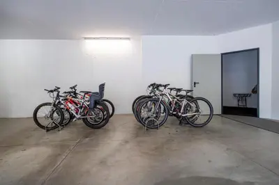 a group of bikes parked in a room at Apartments La Rives in Santa Cristina in Val Gardena