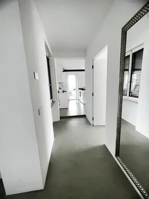 a room with a mirror and a hallway at Merano Absolute View in Merano