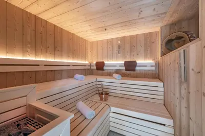 a sauna with wooden walls and ceilings at Oberkantiolhof in Villnoss