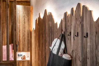 a wooden fence with a bag of stuffed animals in it at Oberkantiolhof in Villnoss