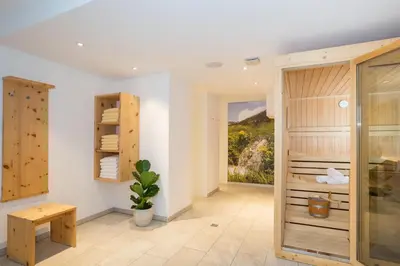 a spa room with a view of a mountain at Residence Aichner in Brunico