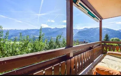 a balcony with a view of the mountains at Pozza Appartamenti in Carano