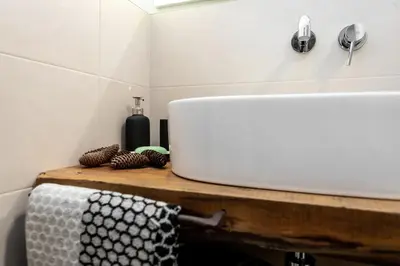 a bathroom counter with a sink and a towel at Agritur E-Cinque in Salorno sulla Strada del Vino