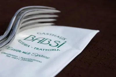 a fork sitting on top of a white napkin at Gasthaus Babsi in Soprabolzano