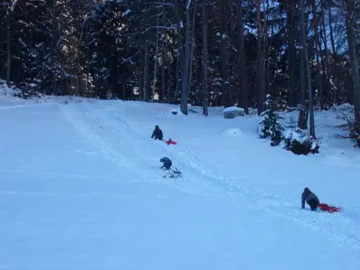 a group of three people in the snow at Gastreinhof in Meltina