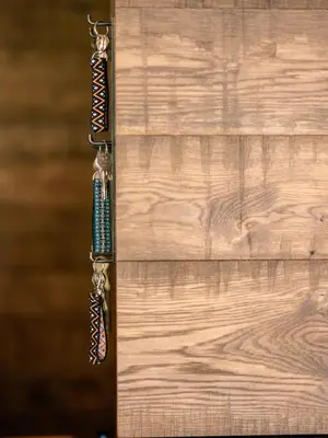 a close up of a wooden door with a tie at Sportony Mountain Lodges in La Villa