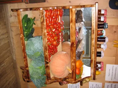 a display of fruits and vegetables on a wall at Hotel Pausa in Montagna