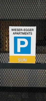 a sign on a fence that reads wiser elevatoragentsrants sun at Residence Maximilian in Vipiteno