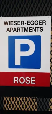 a sign on a fence that reads wiser eiger apartmentrantsrosisrase at Residence Maximilian in Vipiteno