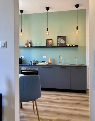 a kitchen with a sink and a counter at Galilei Apartment in Merano