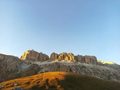 a view of a mountain with rocks in the background at Mansarda Marmolada Canazei, parking, ski slopes 300m in Alba di Canazei