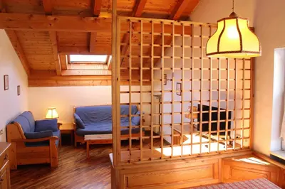 a living room with a bunk bed in a room at Residence Casa Cavalese in Cavalese