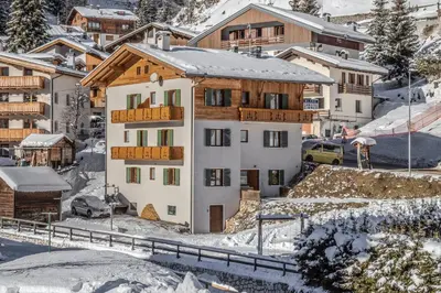 a house in the snow in a village at Affittacamere Blank in Arabba