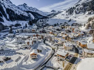 a small town covered in snow in the mountains at Affittacamere Blank in Arabba