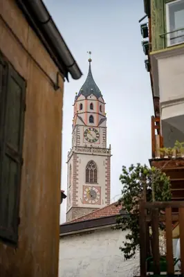 a clock tower on top of a building at Suite - Sweet MayLeen in Merano